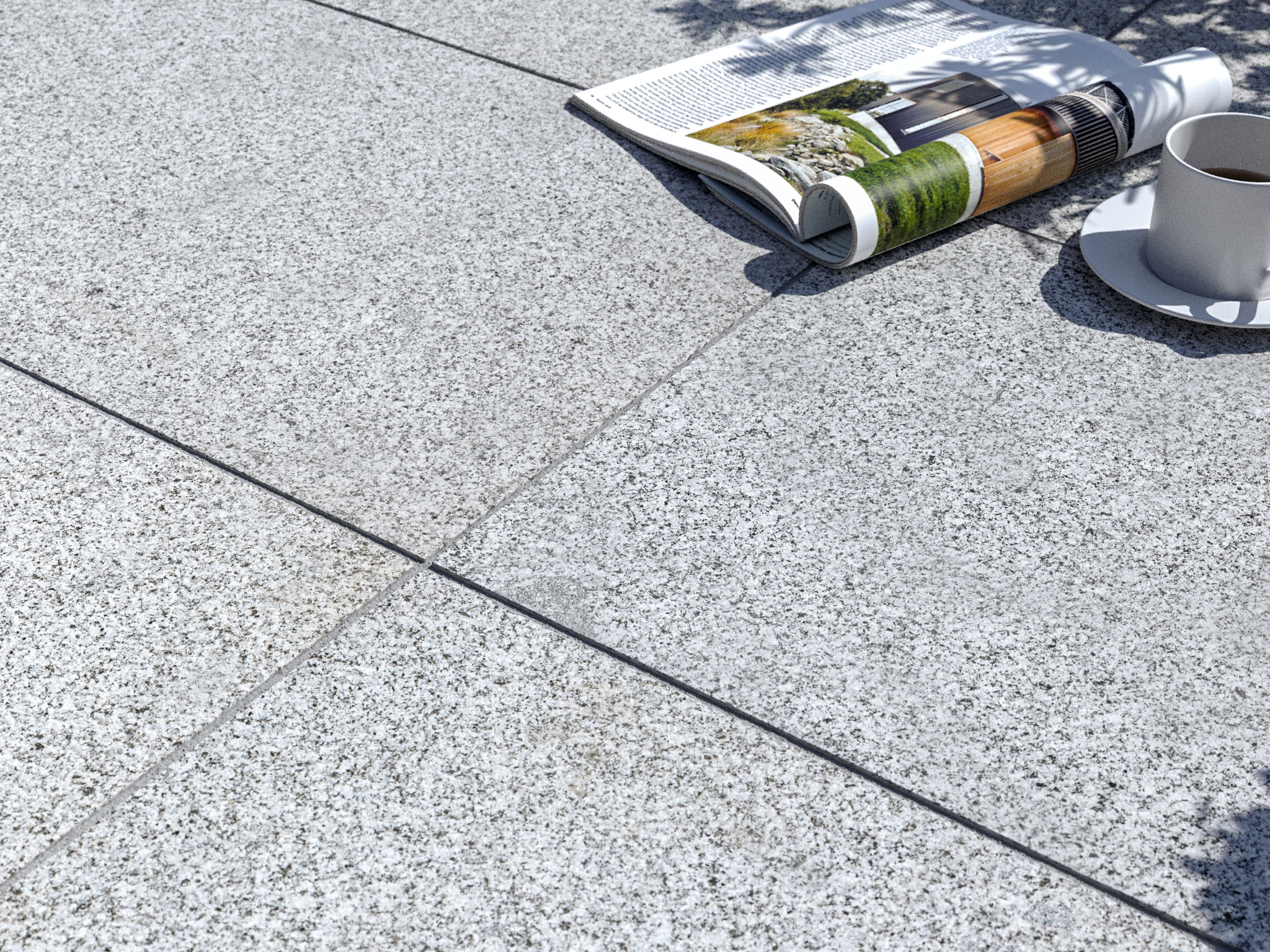 Terrassenplatte Granit Silver Classico  mit Zeitschrift und Kaffeetasse
