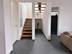 Schiefer-Fliesen Grey Slate verlegt in einem großzügigen Wohnraum mit Treppe